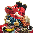 「赤べこのブローチ」